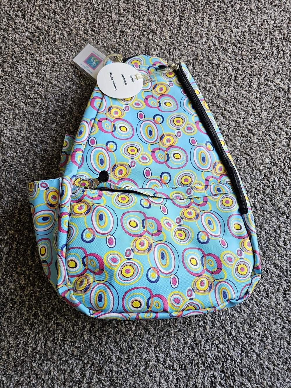 Jetpac Colorful Circle Print Sling Backpack - Turquoise, Yellow, Pink